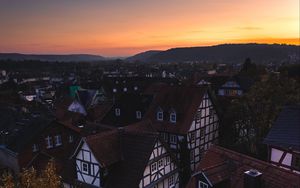 Preview wallpaper town, buildings, aerial view, architecture, sunset, twilight