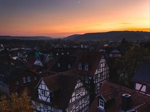 Preview wallpaper town, buildings, aerial view, architecture, sunset, twilight