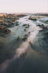 Preview wallpaper town, fog, aerial view, trees, hills