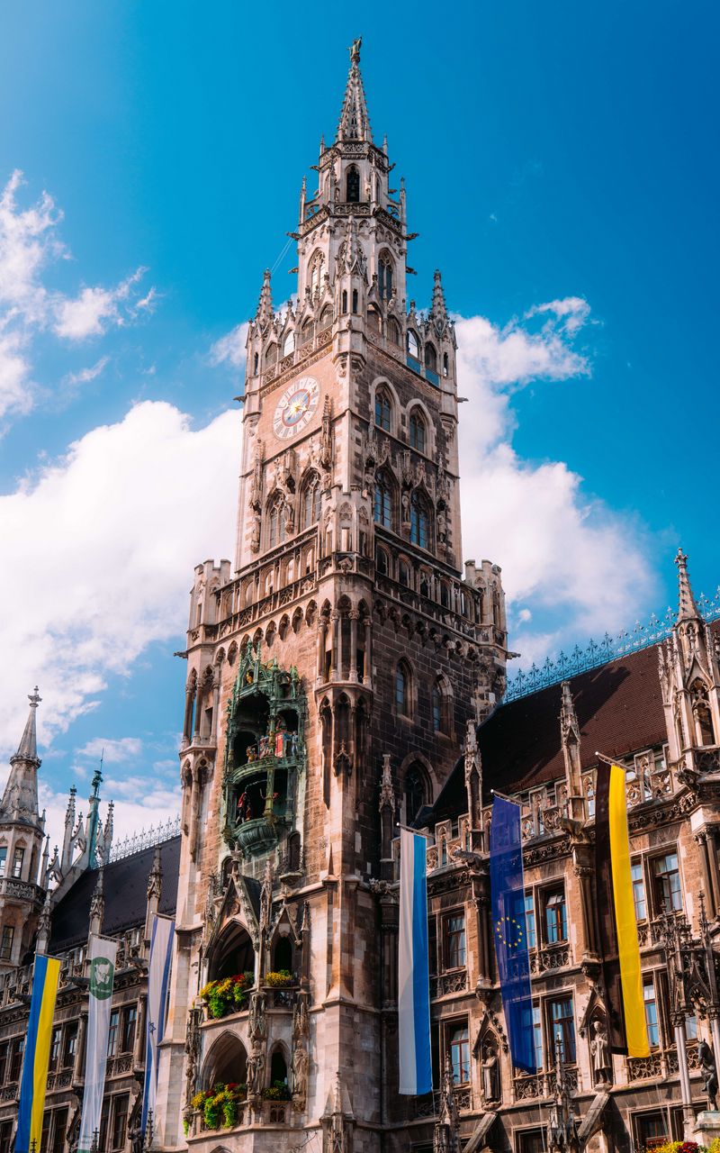 800x1280 Wallpaper town hall, flags, tower, clock, architecture, clouds