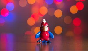 Preview wallpaper toy, parrot, bokeh, glare