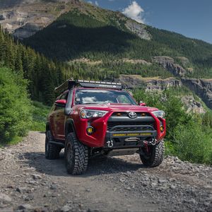 Preview wallpaper toyota 4runner, toyota, car, red, rocks