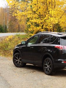 Preview wallpaper toyota, car, black, road, trees, autumn