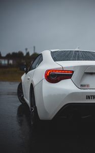 Preview wallpaper toyota, car, rear view, white, wet