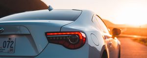 Preview wallpaper toyota, car, sports car, rear view, white, sunset