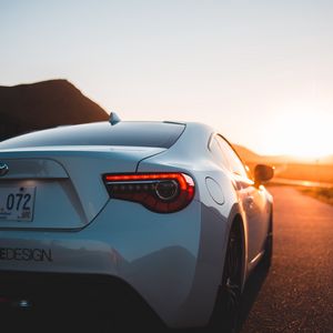 Preview wallpaper toyota, car, sports car, rear view, white, sunset