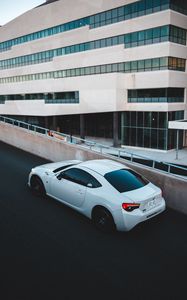 Preview wallpaper toyota, car, sports car, side view, white, building