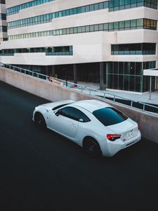 Preview wallpaper toyota, car, sports car, side view, white, building