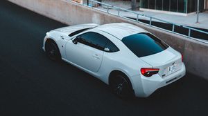 Preview wallpaper toyota, car, sports car, side view, white, building