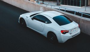 Preview wallpaper toyota, car, sports car, side view, white, building