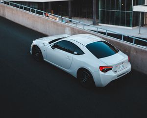 Preview wallpaper toyota, car, sports car, side view, white, building