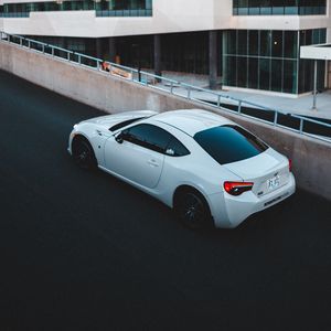 Preview wallpaper toyota, car, sports car, side view, white, building