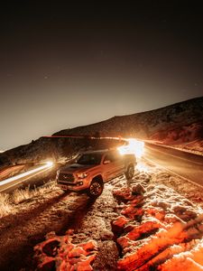 Preview wallpaper toyota, car, suv, gray, light, long exposure, road