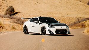 Preview wallpaper toyota gt86, toyota, sports car, car, white, road, hills