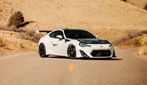 Preview wallpaper toyota gt86, toyota, sports car, car, white, road, hills