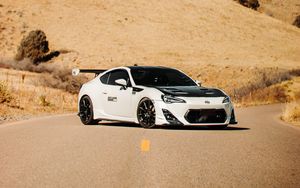 Preview wallpaper toyota gt86, toyota, sports car, car, white, road, hills