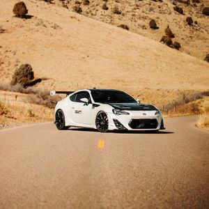 Preview wallpaper toyota gt86, toyota, sports car, car, white, road, hills