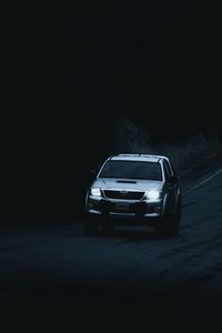 Preview wallpaper toyota hilux, toyota, car, suv, gray, road, dark