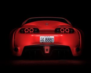 Preview wallpaper toyota supra, toyota, sportscar, red, rear view, dark, backlight