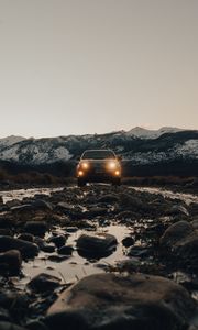 Preview wallpaper toyota, vehicle, suv, front view, road, rocks, headlights
