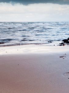 Preview wallpaper traces, person, life, coast, beach, sand, sky, cloudy