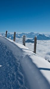 Preview wallpaper track, road, lifting, snow, winter, mountains, stakes