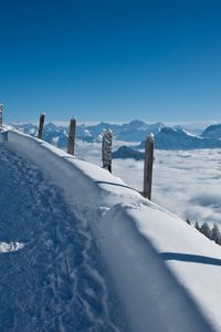 Preview wallpaper track, road, lifting, snow, winter, mountains, stakes