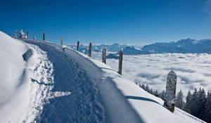 Preview wallpaper track, road, lifting, snow, winter, mountains, stakes