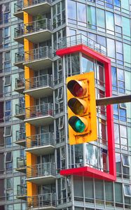 Preview wallpaper traffic light, building, balconies, facade, architecture