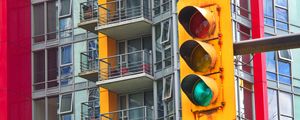 Preview wallpaper traffic light, building, balconies, facade, architecture