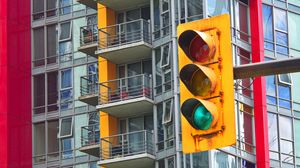 Preview wallpaper traffic light, building, balconies, facade, architecture