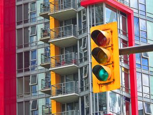 Preview wallpaper traffic light, building, balconies, facade, architecture