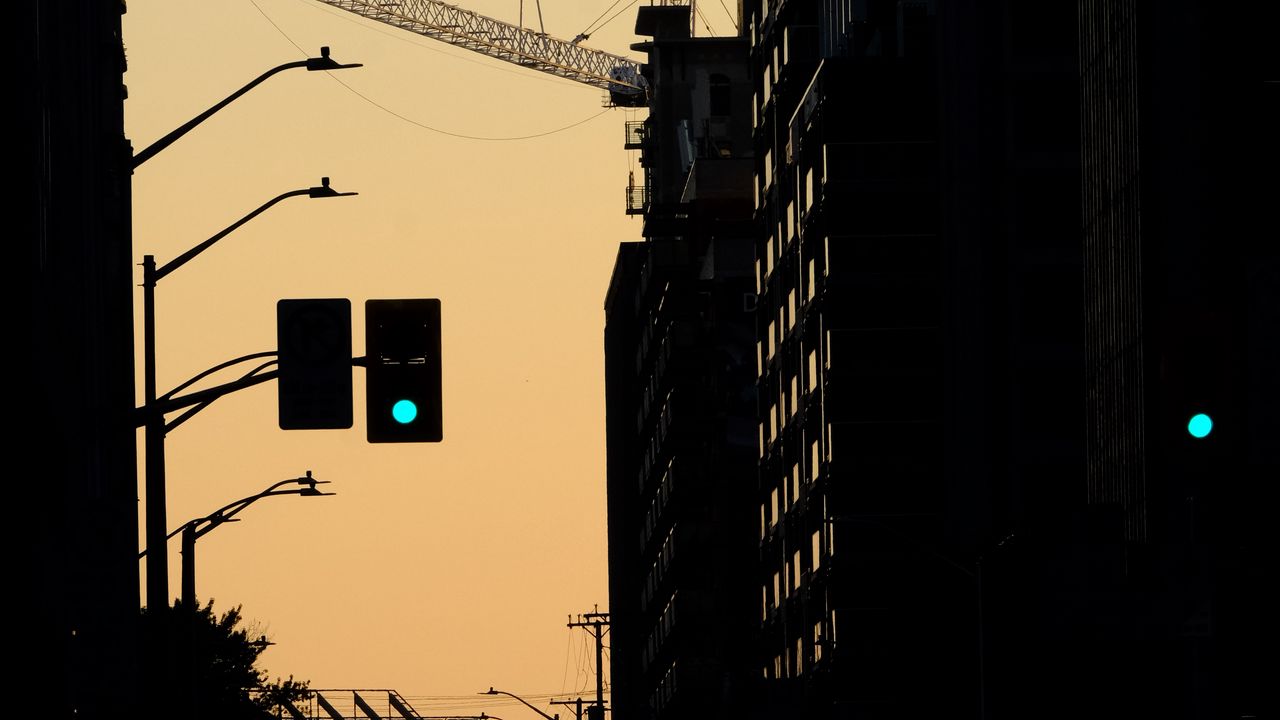 Wallpaper traffic light, construction crane, buildings, evening, silhouettes