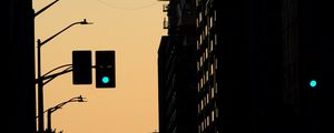 Preview wallpaper traffic light, construction crane, buildings, evening, silhouettes