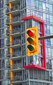 Preview wallpaper traffic light, house, building, architecture, balconies