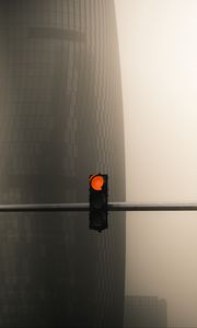 Preview wallpaper traffic light, pillar, building, skyscraper, fog