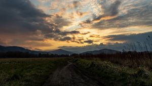 Preview wallpaper trail, field, grass, mountains, trees, clouds, landscape