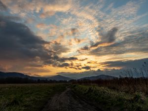 Preview wallpaper trail, field, grass, mountains, trees, clouds, landscape