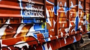 Preview wallpaper trailer, car, graffiti, colorful, metal