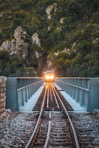 Preview wallpaper train, bridge, rock, light