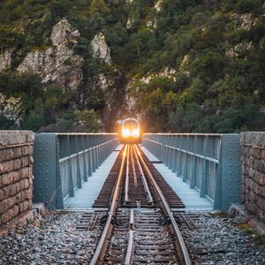 Preview wallpaper train, bridge, rock, light