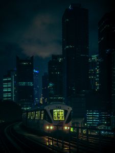 Preview wallpaper train, city, night, buildings, dark