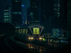 Preview wallpaper train, city, night, buildings, dark