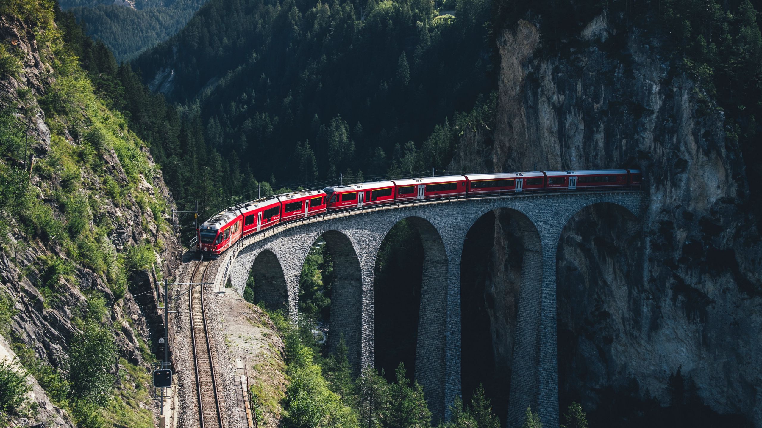 Download wallpaper 2560x1440 train, mountains, aerial view, bridge, railway  widescreen 16:9 hd background