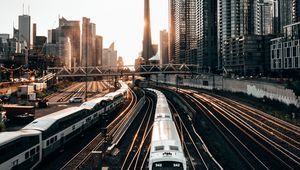 Preview wallpaper train, rails, city, buildings, sunset