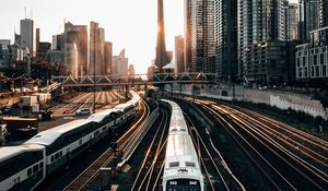 Preview wallpaper train, rails, city, buildings, sunset