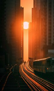 Preview wallpaper train, railway, buildings, sun, sunset