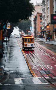 Preview wallpaper tram, rails, street, rain, buildings