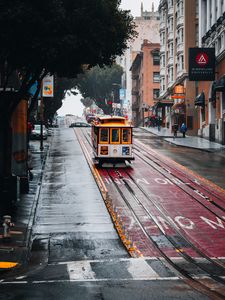 Preview wallpaper tram, rails, street, rain, buildings