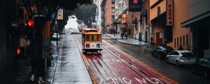 Preview wallpaper tram, rails, street, rain, buildings